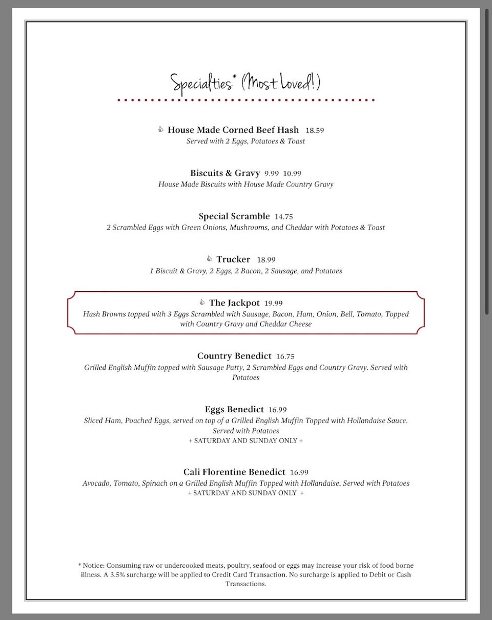 Restaurant menu beside a coffee cup